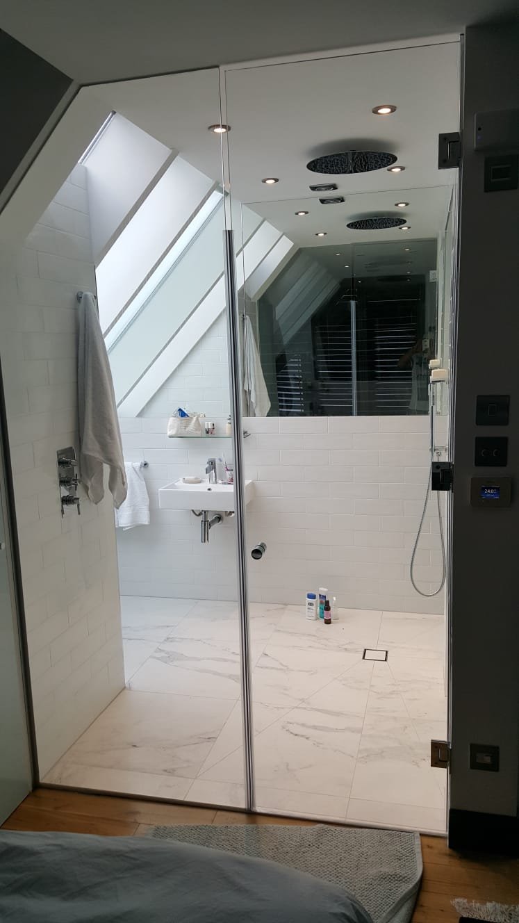 Loft en-suite with frameless glass shower